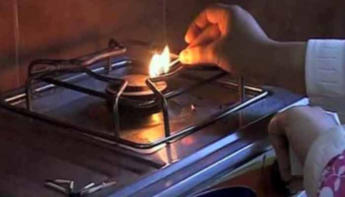 A person tries to light a stove, unsuccessfully. Photo: File