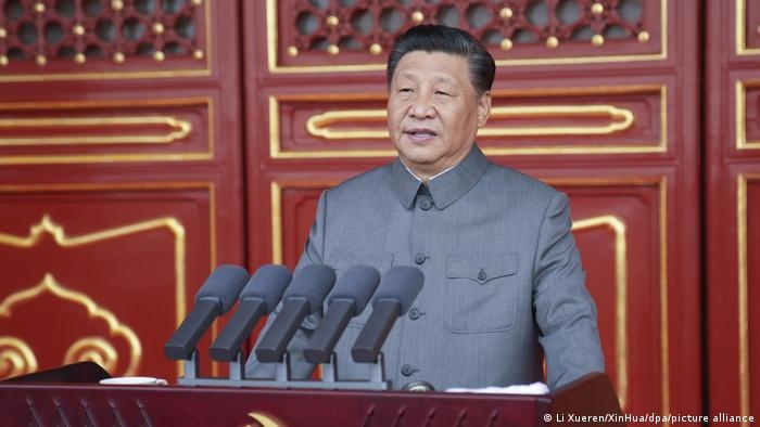 Chinese President Xi Jinping addresses a massive crowd.