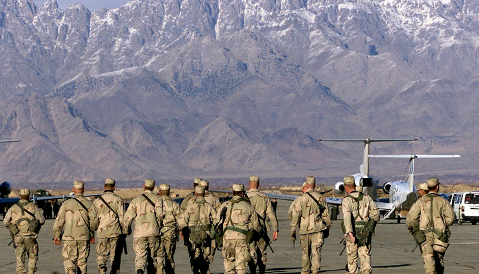 In this file photo taken on January 15, 2002, American soldiers approach the United Nations planes on the tarmac of the Bargam airbase in Bagram. All US and NATO troops have left Bagram Air Base, a US defence official told AFP Friday, signalling the complete withdrawal of foreign forces from Afghanistan was imminent. — AFP/File
