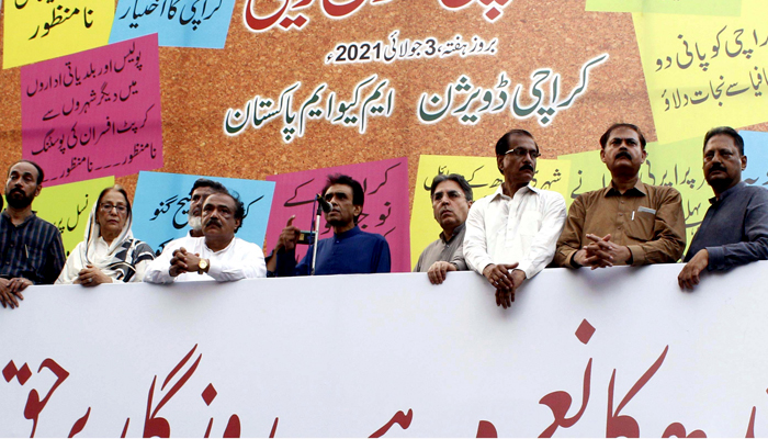 MQM-P Convener Dr. Khalid Maqbool Siddiqui can be seen on stage along with other party leaders as he addresses a protest against the policies of the Sindh government in Karachi, on July 03, 2021. — PPI