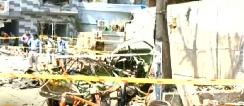 The mangled remains of a rickshaw parked nearby. — Geo News