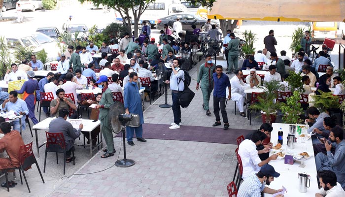People can be seen at a restaurant at Blue Area in Islamabad, on June 27, 2021. — Online/File
