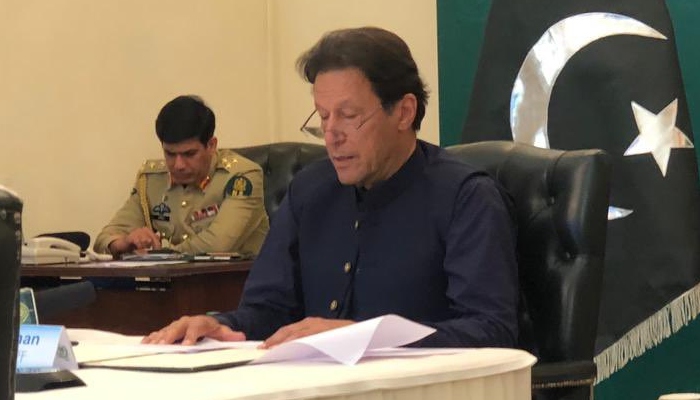A picture of Prime Minister Imran Khan reading a dossier. Photo: Twitter