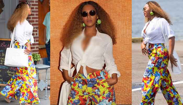 Beyonce cuts a stylish figure in colorful pants and white top while boarding a helicopter