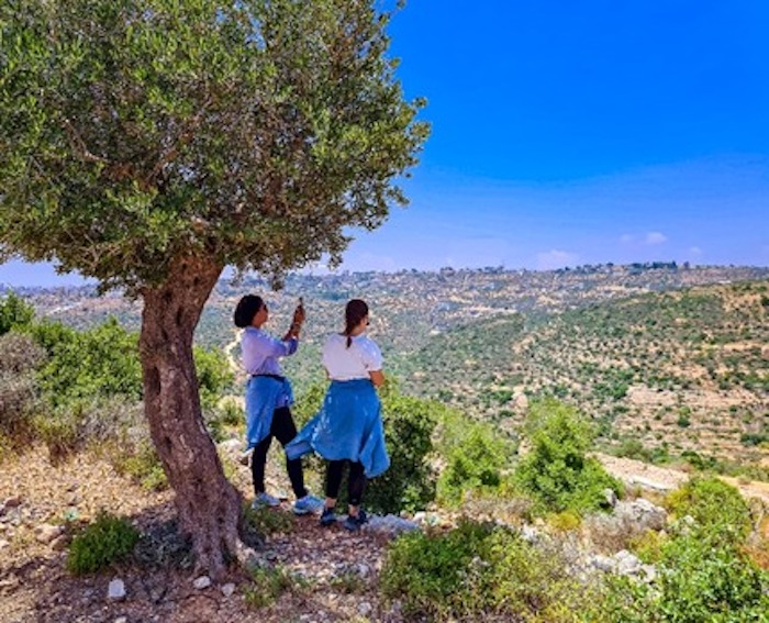 Travel bloggers Malak Hassan and Bisan Alhajhasan visit a village called Jifna near Ramallah.  Photo: Courtesy of Ahlan Palestine
