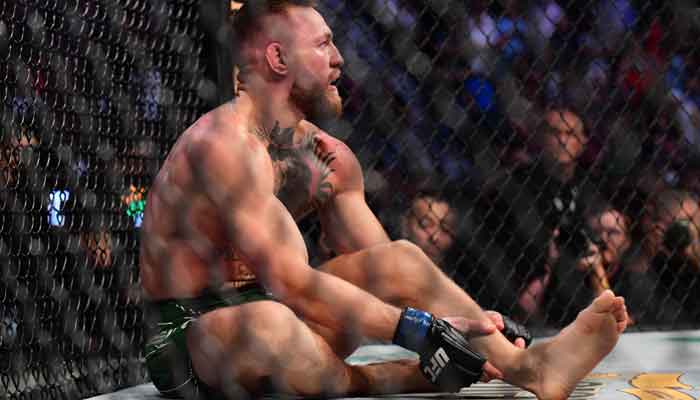 Conor McGregor reacts after suffering an injury in his loss to Dustin Poirier during UFC 264 at T-Mobile Arena, July 10, 2021, Las Vegas, Nevada, USA. — Reuters via Gary A. Vasque/USA TODAY Sports