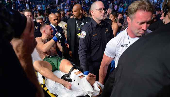 Conor McGregor is carried off a stretcher following an injury suffered against Dustin Poirier during UFC 264 at T-Mobile Arena, Las Vegas, Nevada, USA, July 10, 2021.  — Reuters via Gary A. Vasque/USA TODAY Sports