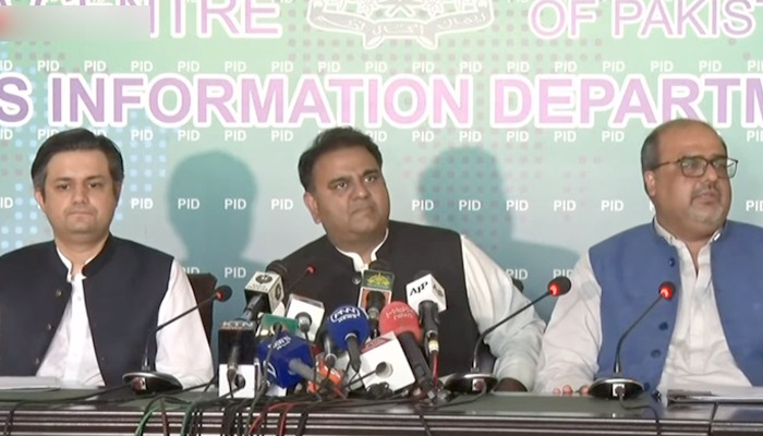 Federal ministers Hammad Azhar, Fawad Chaudhry and Adviser to PM Shahzad Akbar during a press conference at the Press Information Department. Photo: Screengrab via Hum News.