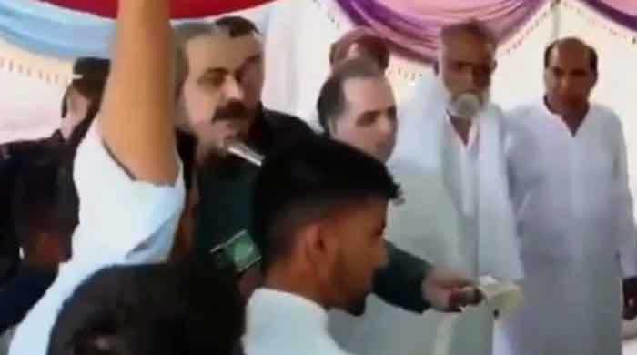 PTI minister Ali Amin Gandapur in hot water over cash donation during AJK campaign