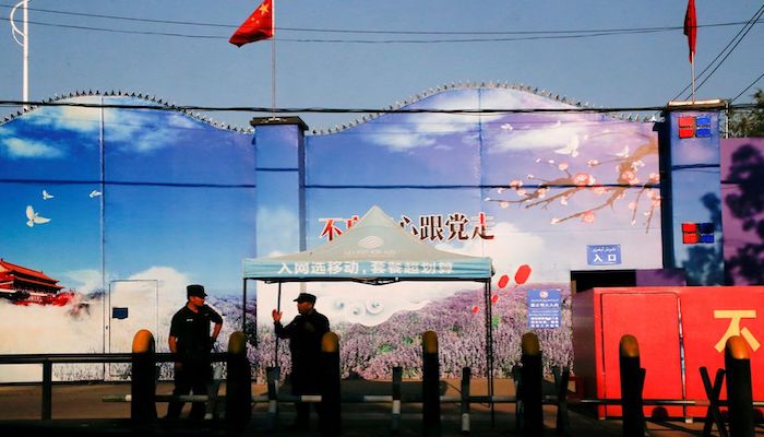 Security guards stand at the gates of what is officially known as a vocational skills education center in Huocheng County in Xinjiang Uighur Autonomous Region, China September 3, 2018. Photo: Reuters