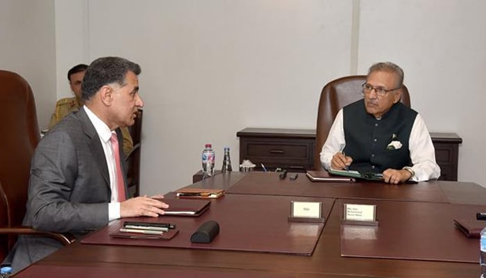 President Dr Arif Alvi being briefed by Director General Inter-Services Intelligence Lt. Gen. Faiz Hamid, on July 15, 2021. — Presidents Secretariat