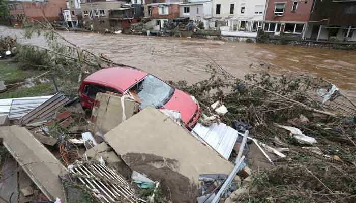 A damaged vehicle is seen next to the river, following heavy rainfalls, in Pepinster, Belgium, July 16, 2021. — Reuters/Yves Herman