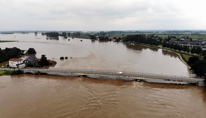 This aerial picture taken on July 16, 2021, shows the Maas river in Maaseik, northern Belgium, where the situation remains critical as the water keep rising after the heavy rainfall of the previous days. &mdash; AFP