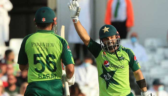 Mohammad Rizwan (R) celebrates his half century during a T20 cricket match between England and Pakistan at Trent Bridge, Nottingham, England on July 16, 2021. Photo: AFP