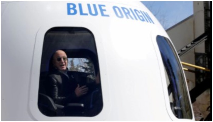 Amazon and Blue Origin founder Jeff Bezos addresses the media about the New Shepard rocket booster and Crew Capsule mockup at the 33rd Space Symposium in Colorado Springs, Colorado, United States April 5, 2017. REUTERS/Isaiah J. Downing/File Photo