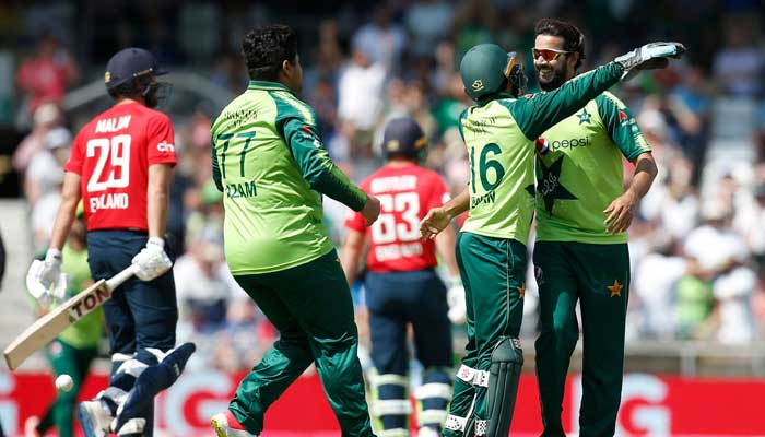 Pakistans Mohammad Rizwan congratulates Imad Wasim after he took wicket during the second T20 against England.