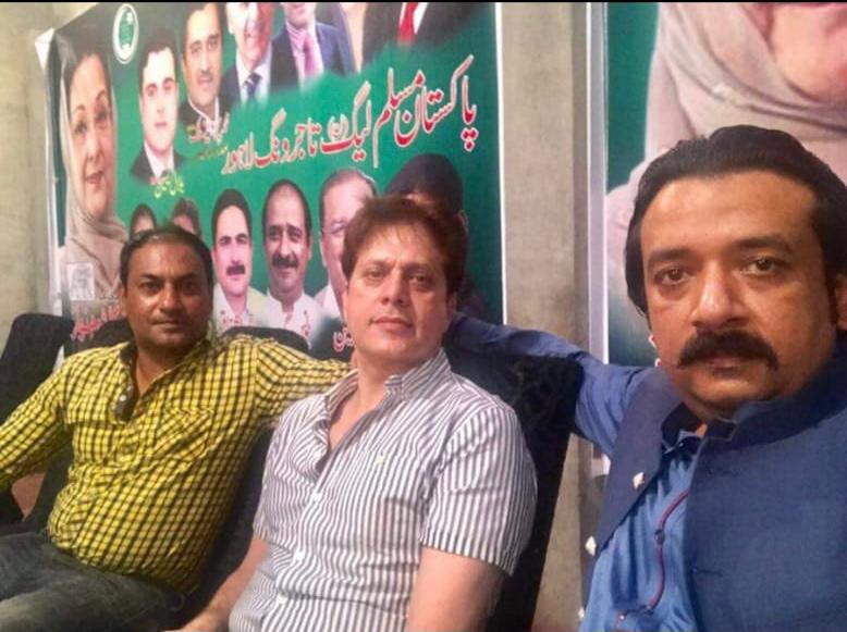 Shahid Khan (center) in an old picture taken while he attended a PML-N event in Lahore. Family sources say he later left the PML-N and joined the PTI. Photo: author