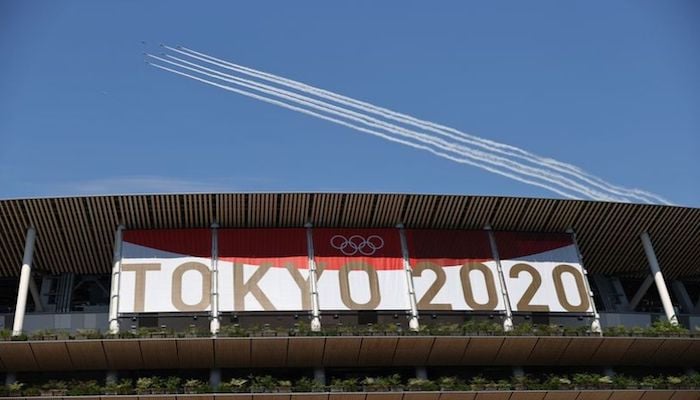 Tokyo 2020 Olympics Preview - Olympic Stadium, Tokyo, Japan - July 21, 2021 Japans aerobatics team, the Blue Impulse, during a practice run for the opening ceremony. Photo: Reuters