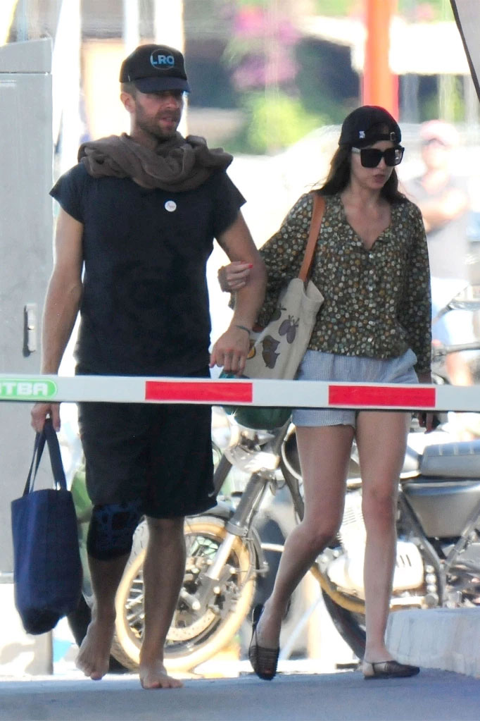 Photos: Dakota Johnson, Chris Martin caught boat riding in Spain