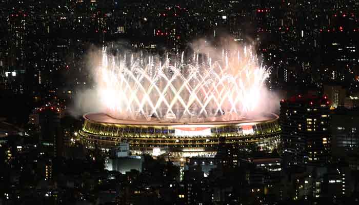 Fireworks are launched above the Olympic Stadium after the Olympic flame is lit during the opening ceremony of the Tokyo 2020 Olympics, Olympic Stadium, Tokyo, Japan, July 23, 2021. — Reuters/Kim Kyung-Hoon