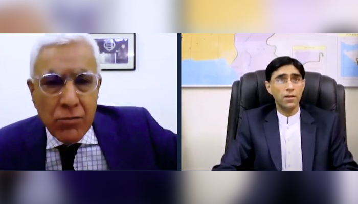 National Security Adviser Moeed Yusuf (right) speaks during an interview with Indian journalist Karan Thapar (left). — The Wire