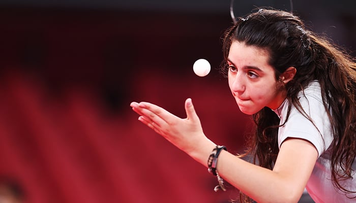 Tokyo 2020 Olympics - Table Tennis - Womens Singles - Preliminary Round - Tokyo Metropolitan Gymnasium - Tokyo, Japan - July 24, 2021. Hend Zaza of Syria in action against Jia Liu of Austria. — Reuters