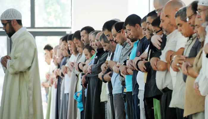 Muslims pray at the Grand Mosque of Villeneuve-dAscq, northern France, on August 01, 2011. — AFP/Philippe Huguen