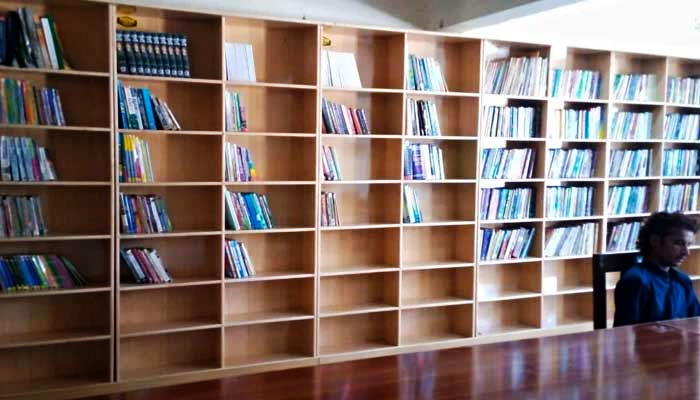 The library set up by student activists in Sindhs Karoondi Town has books on a wide range of topics. — Photo by authors