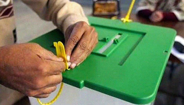 Picture showing the hands of a man touching a ballot box. Photo: File.