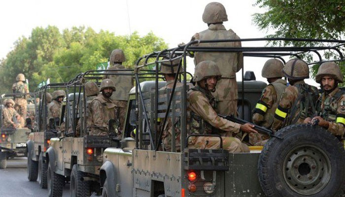 Army personnel can be seen sitting in a military vehicle. — File photo