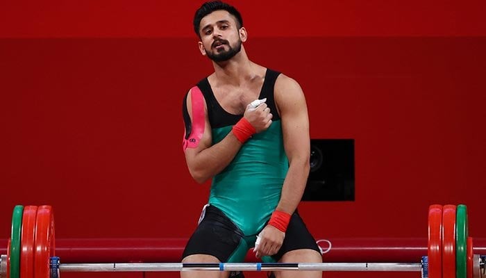 Tokyo 2020 Olympics - Weightlifting - Mens 67kg - Group A - Tokyo International Forum, Tokyo, Japan - July 25, 2021. Talha Talib of Pakistan celebrates after a lift. Photo: Reuters