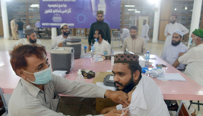 A person receiving the coronavirus vaccine at a vaccination centre in Lahore, on July 12, 2021. — Online/File