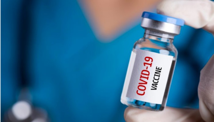 A person holding a vial of COVID-19 vaccine. Photo: AFP.