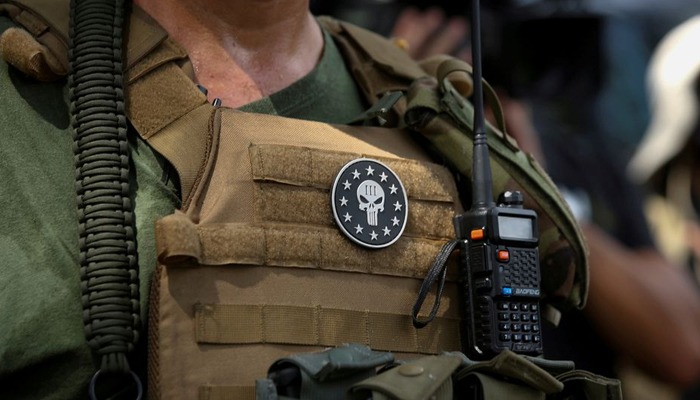 A militia member with body armor and a Three Percenters militia patch stands in Stone Mountain as various militia groups stage rallies at Stone Mountain, Georgia, US August 15, 2020. — Reuters/File