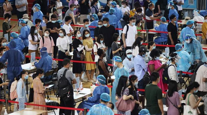 China reports highest daily rise in new coronavirus cases since January