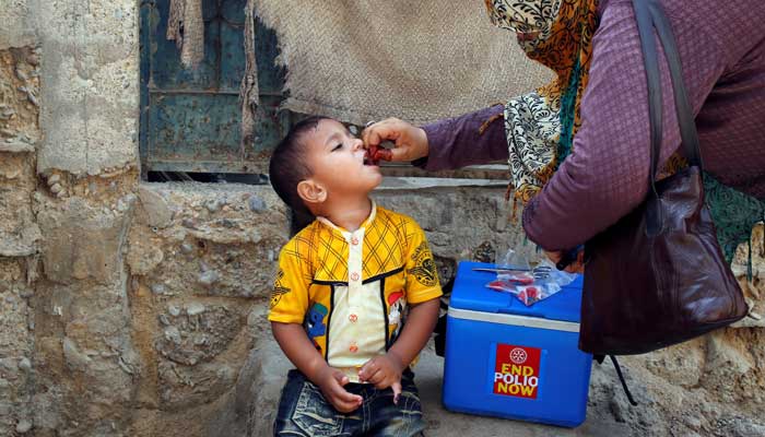 A health worker administering polio drops on a child. Photo: Files