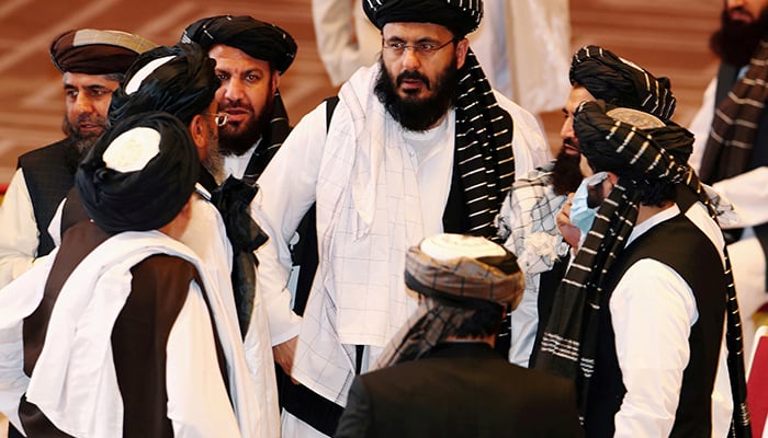 Taliban delegates speak during talks between the Afghan government and Taliban in Doha, Qatar September 12, 2020. — Reuters/File