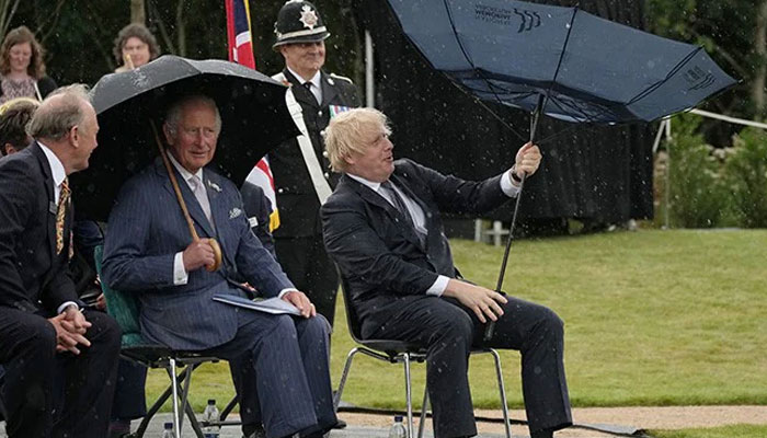 Prince Charles bursts into laughter seeing British PM Boris Johnson struggling with umbrella: Video