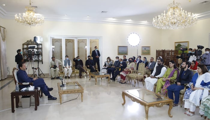 Prime Minister Imran Khan speaking to the Pak Afghan Youth Forum delegation at the PM Office. Photo: Twitter/PM Office