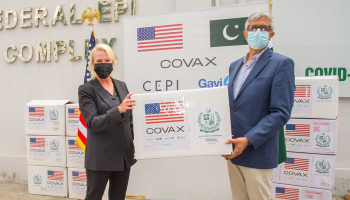Special Assistant to Prime Minister on Health Dr Faisal Sultan (right) receiving Moderna vaccine doses from US Embassy Chargé d’affaires Angela P Aggeler in Islamabad during a handover ceremony on July 29, 2021. — Twitter