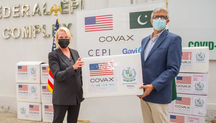 Special Assistant to Prime Minister on Health Dr Faisal Sultan (right) receiving Moderna vaccine doses fromUS Embassy Chargé d’affaires Angela P Aggeler in Islamabad during a handover ceremony on July 29, 2021. — Twitter