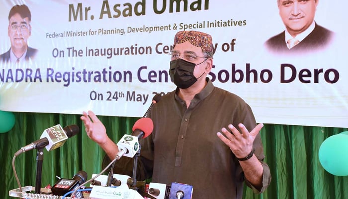 Federal Minister for Planning, Development, and Special Initiatives Asad Umar addressing an inaugration ceremony of NADRA registration centre at Sobho Dero, on May 24, 2021. — APP/File