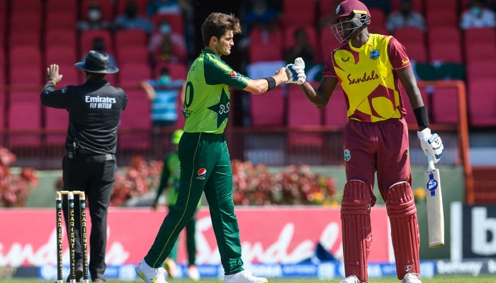 Jason Holder (R) of the West Indies congratulate Shareen Afridi (L) of Pakistan for winning the 2nd T20I match between the West Indies and Pakistan at Guyana National Stadium in Providence, Guyana, on July 31, 2021. — AFP