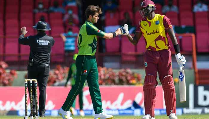 Jason Holder (R) of the West Indies congratulate Shareen Afridi (L) of Pakistan for winning the 2nd T20I match between the West Indies and Pakistan at Guyana National Stadium in Providence, Guyana, on July 31, 2021. — Photo by Randy Brooks/AFP