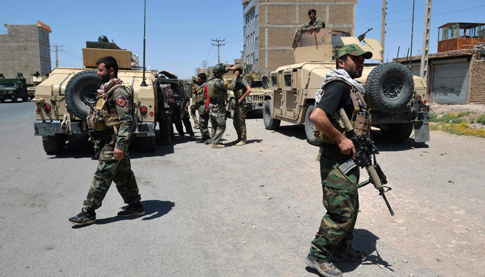 In this picture taken on August 1, 2021, Afghan National Army commando forces walk along a road amid ongoing fighting between Taliban and Afghan security forces in the Enjil district of Herat province. — AFP/File