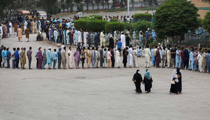 Residents line up to receive a vaccine against coronavirus disease (COVID-19) at a vaccination facility in Karachi, Pakistan, August 3, 2021. -REUTERS