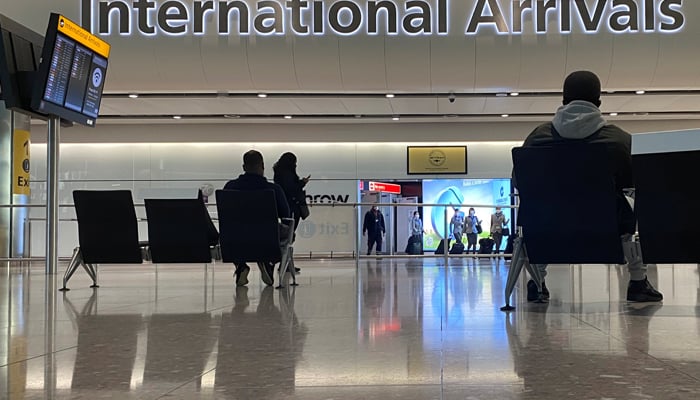 Travellers are seen at an arrivals area of a terminal at Heathrow Airport, amid the spread of the coronavirus disease (COVID-19) pandemic, London, Britain, January 16, 2021. — Reuters/File