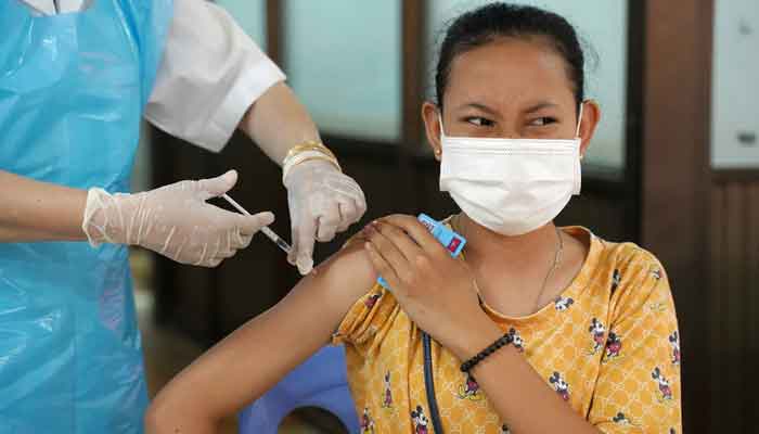 A teenager receives a vaccine dose against the coronavirus disease (COVID-19) at a health center as Cambodia begins its vaccination campaign for ages 12 to 17, in Phnom Penh, Cambodia, August, 1, 2021. — Reuters/Cindy Liu