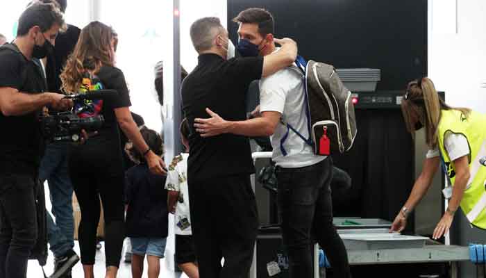 Lionel Messi is seen at Josep Tarradellas Barcelona-El Prat Airport with his wife Antonela and their children before flying to Paris, August 10, 2021. — Reuters/Albert Gea