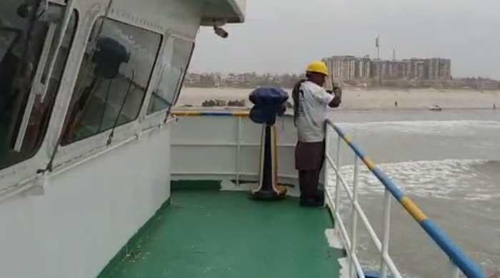 Watch: How the cargo ship stuck on Karachi's Seaview beach is being freed